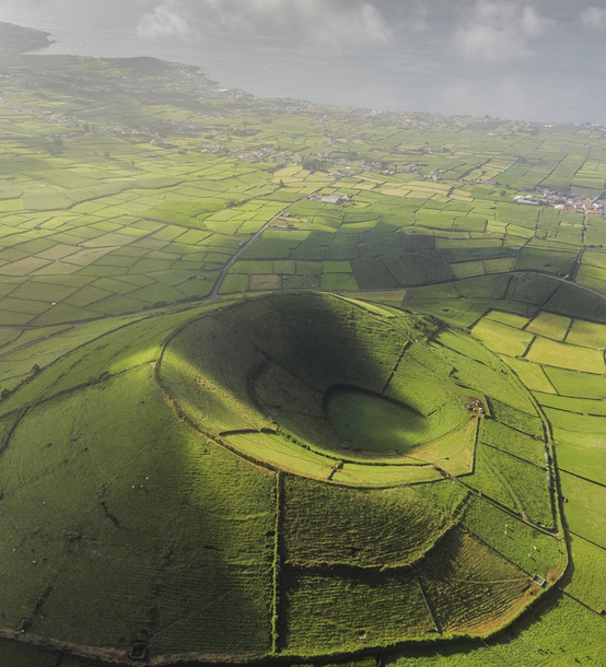 Azores, Portugal Retreat - aerial view of volcanic crater with lush green fields