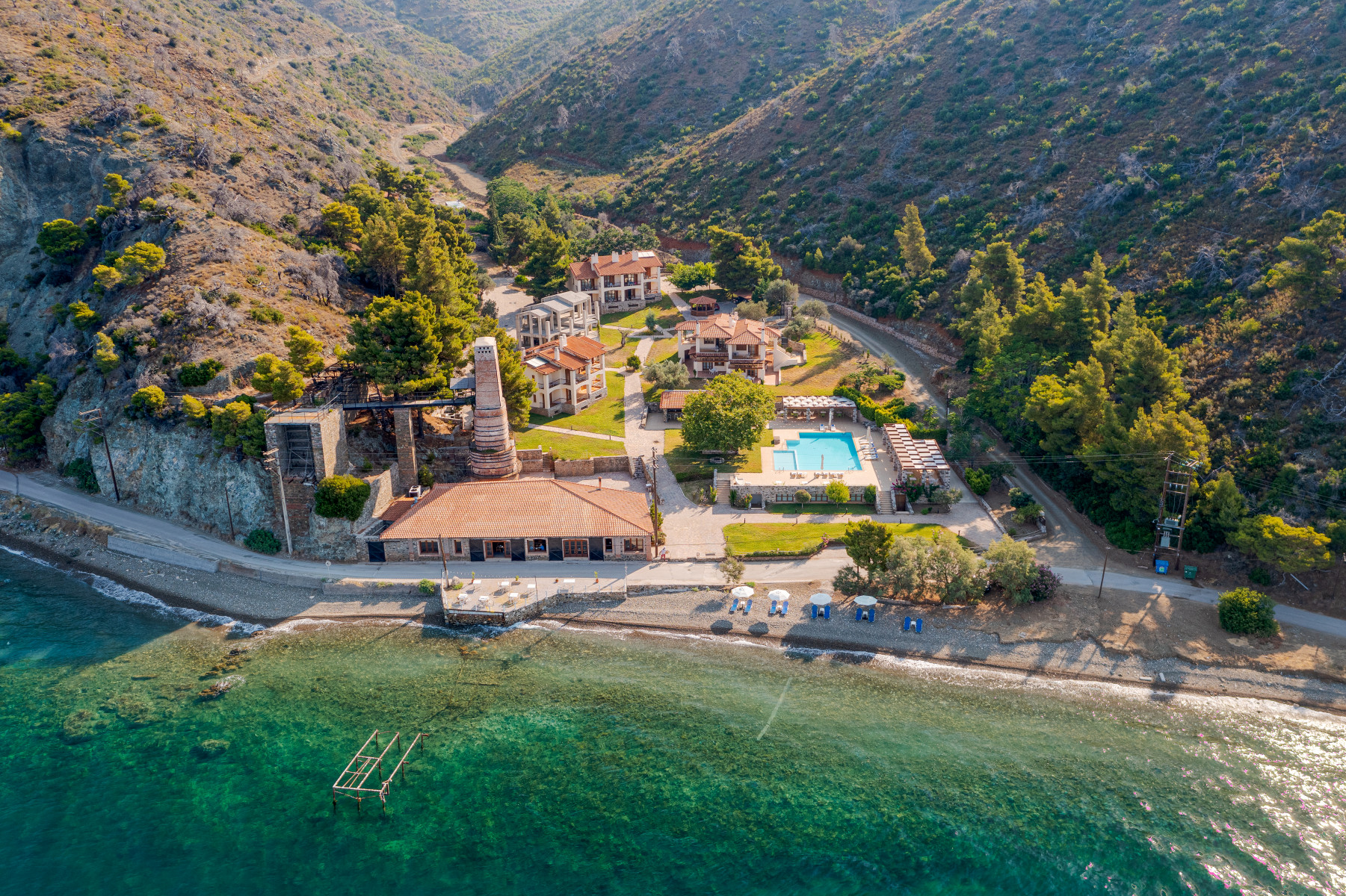 Greece Retreat - Kaminos Resort aerial view with beach and mountains