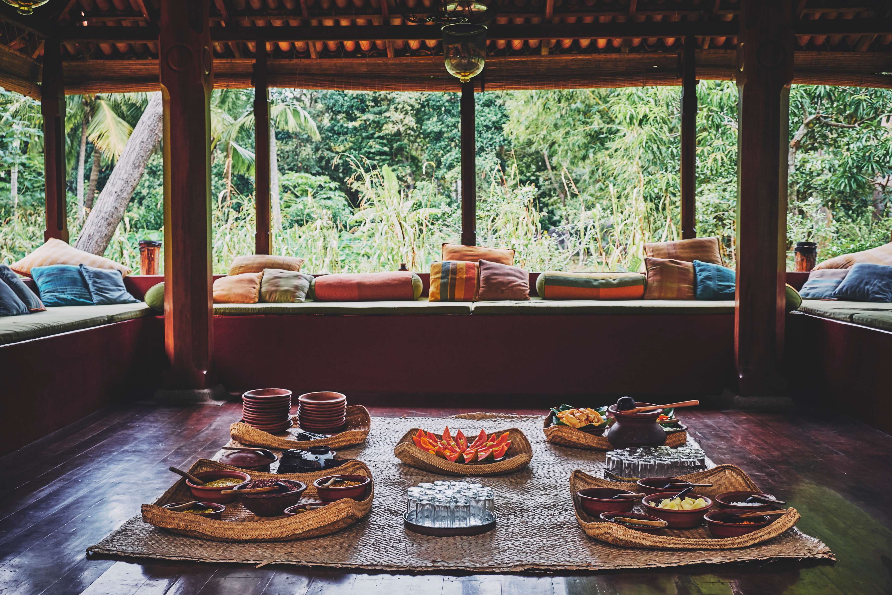Traditional Ambalama dining pavilion with Sri Lankan meal spread